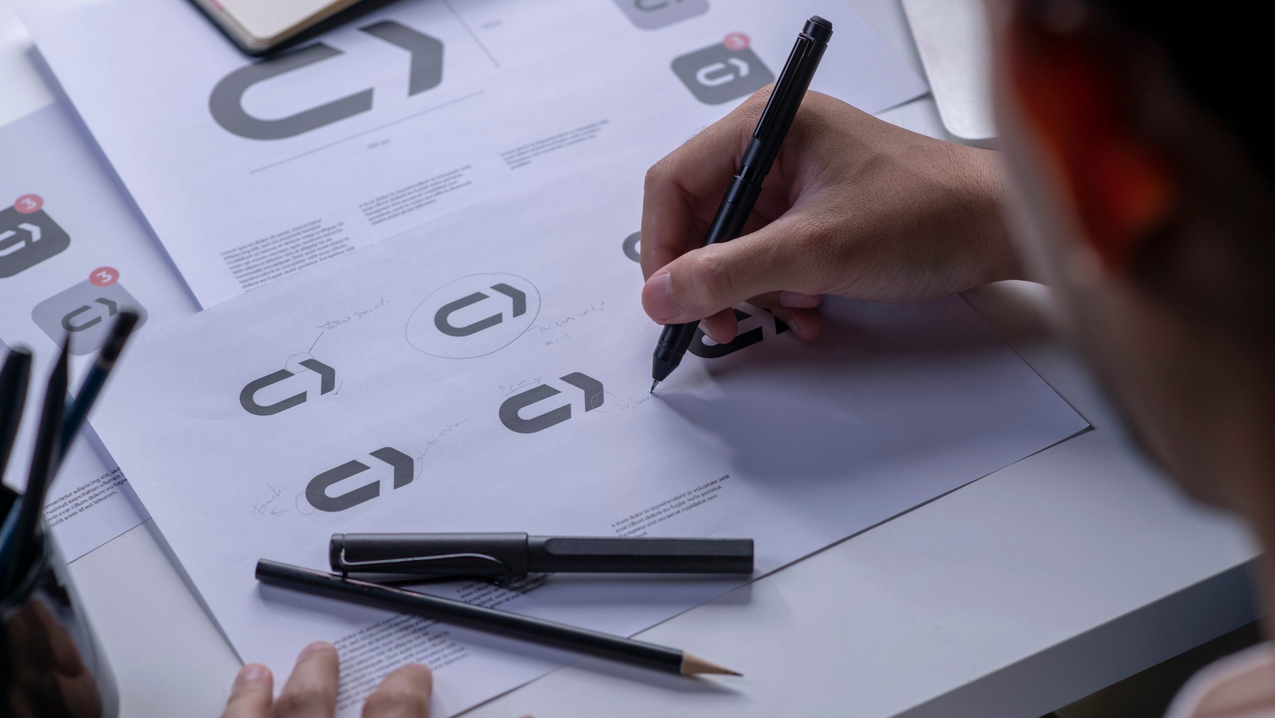 Graphic Designer working on logo creation for branding