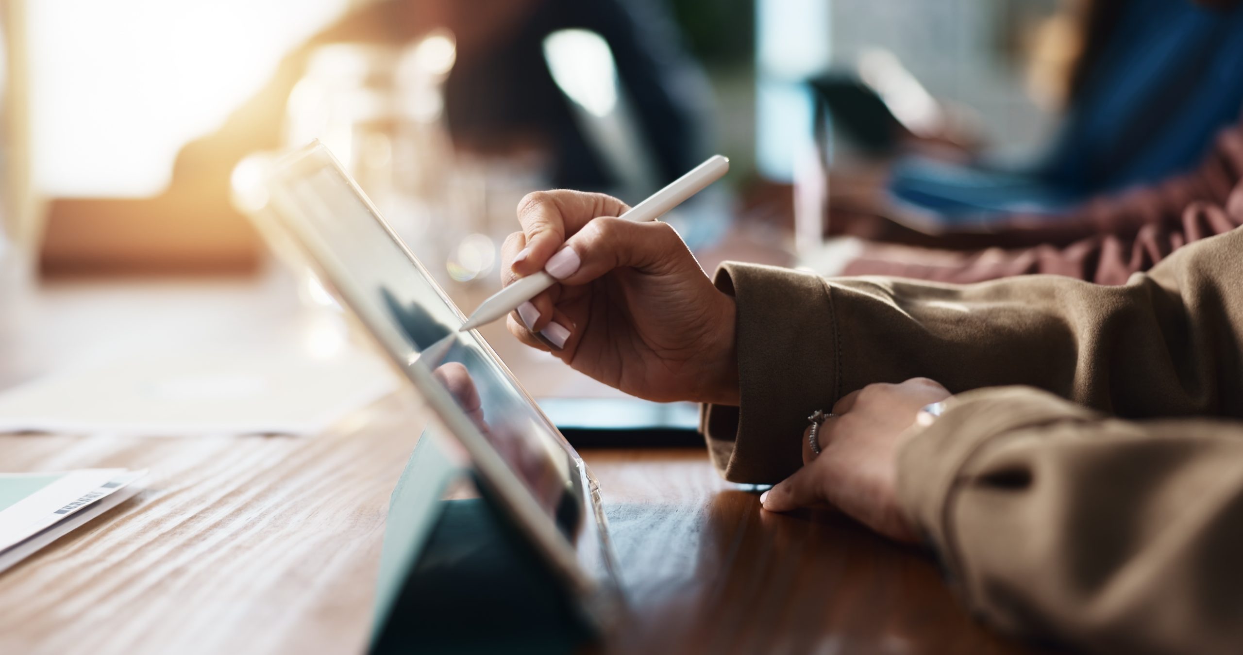 Web designer using an iPad to create an AI-assisted website design in Melbourne