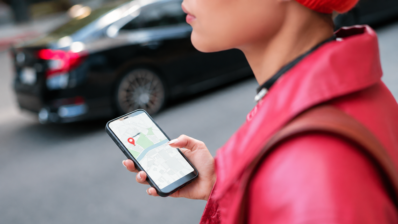 Woman using a smartphone to improve her business ranking on Google Maps in Melbourne